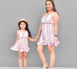 Mother and daughter matching outfits-Mother and daughter in multicolored matching outfits.