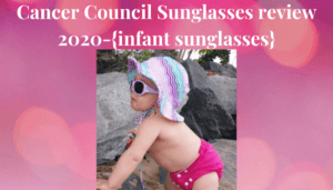 Cancer Council Sunglasses Review 2020-Baby standing by rocks wearing Cancer council Sunglasses