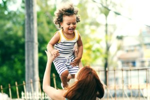 How not to feel guilty about everything-Mum throwing smiling child in the sky