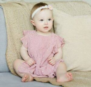 Best gender neutral baby clothes-baby girl in pink dress