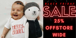 Does Finn + Emma have Black Friday sales for their organic baby clothes?-Image of baby wearing Finn + Emma outfit and holding a soft toy.