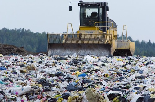 Would you consider renting the baby clothes for a newborn?-Machinery working on landfill site.