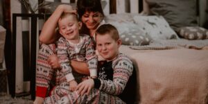 When does Burt's bees release Christmas Pajamas?-Mother with 2 children wearing matching Christmas pajamas.
