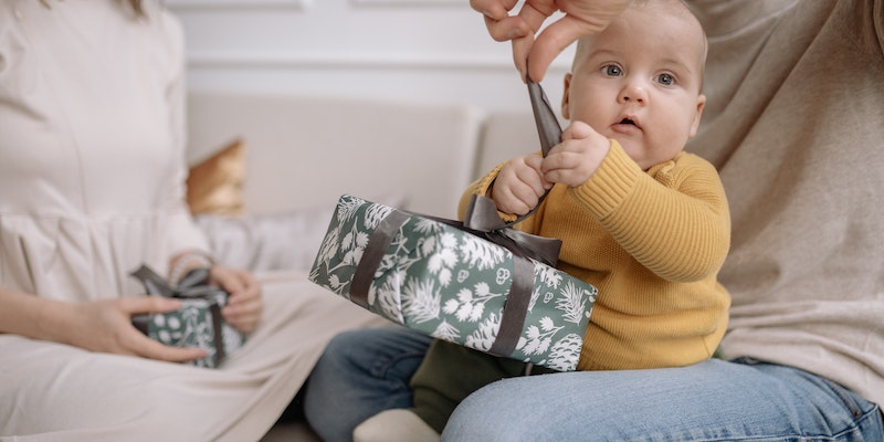 Does Baby Gap have a registry?-Image of baby receiving a gift.