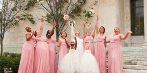 Flower girl dresses for weddings.- Image of women 4 women in pink flower dresses and 2 girls in white flower dresses.