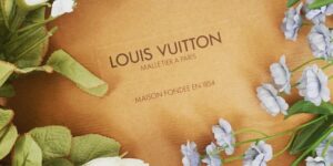 Does Louis Vuitton make High-end newborn baby clothes?- Image of a Louis Vuitton bx with flowers.